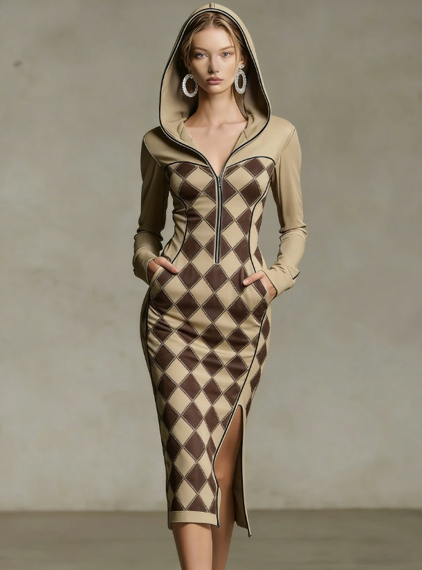 A model wears a fitted hooded long-sleeve dress with a beige and dark brown harlequin diamond pattern, a front zipper, and a thigh-high slit, set against a neutral studio backdrop.