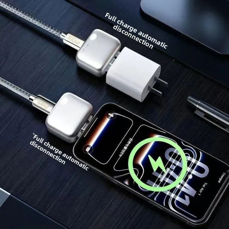A silver 140W smart charging adapter connected inline between a white power brick and a braided USB-C cable plugging into a smartphone displaying a glowing green battery charging graphic.