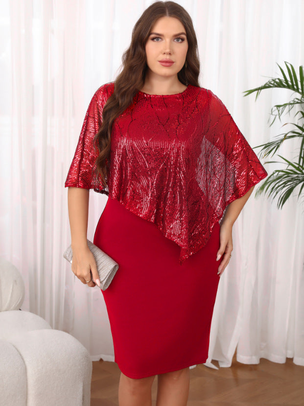 Woman wearing a red dress with a sequin top in a room with white curtains and a plant.