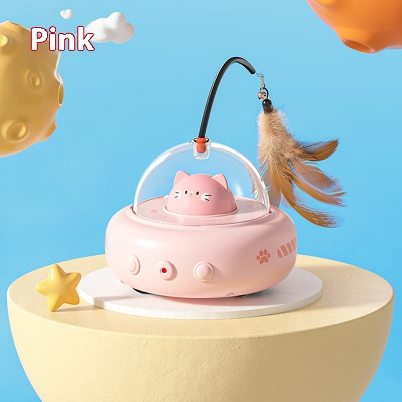 Pink cat-shaped toy with a transparent dome on a yellow stand against a blue background