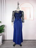Blue evening gown with lace sleeves on a mannequin against a neutral background