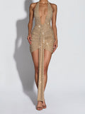 Gold beaded dress with a plunging neckline on a white background
