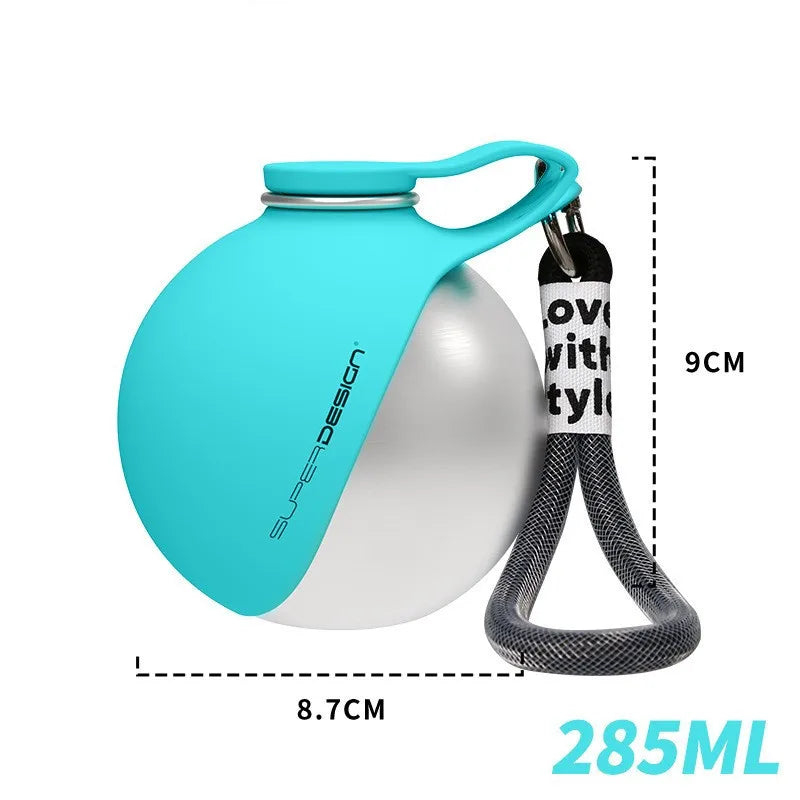 Teal and silver stainless steel portable dog water bottle with a carry strap, featuring measurement overlays showing a 9cm width and 8.7cm depth, highlighting its compact and convenient design for pets.
