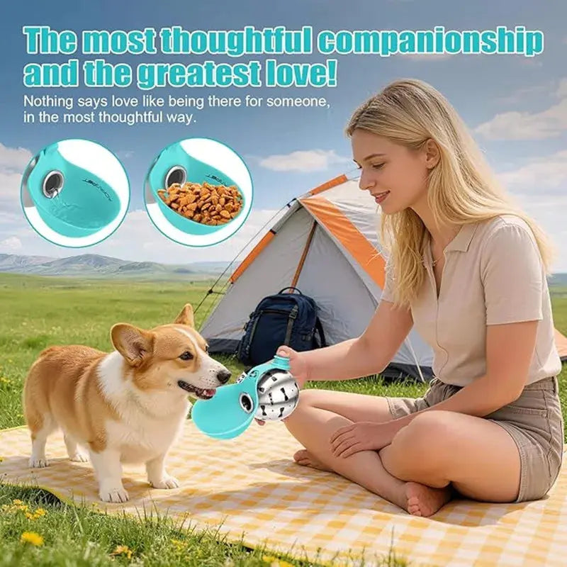 A woman and her dog sitting on a picnic blanket at a campsite, with the stainless steel portable dog water bottle shown in the foreground demonstrating its use as a bowl for both water and dry food.