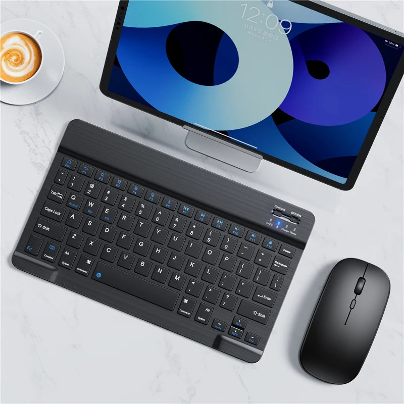 Tablet with a keyboard and mouse on a light surface
