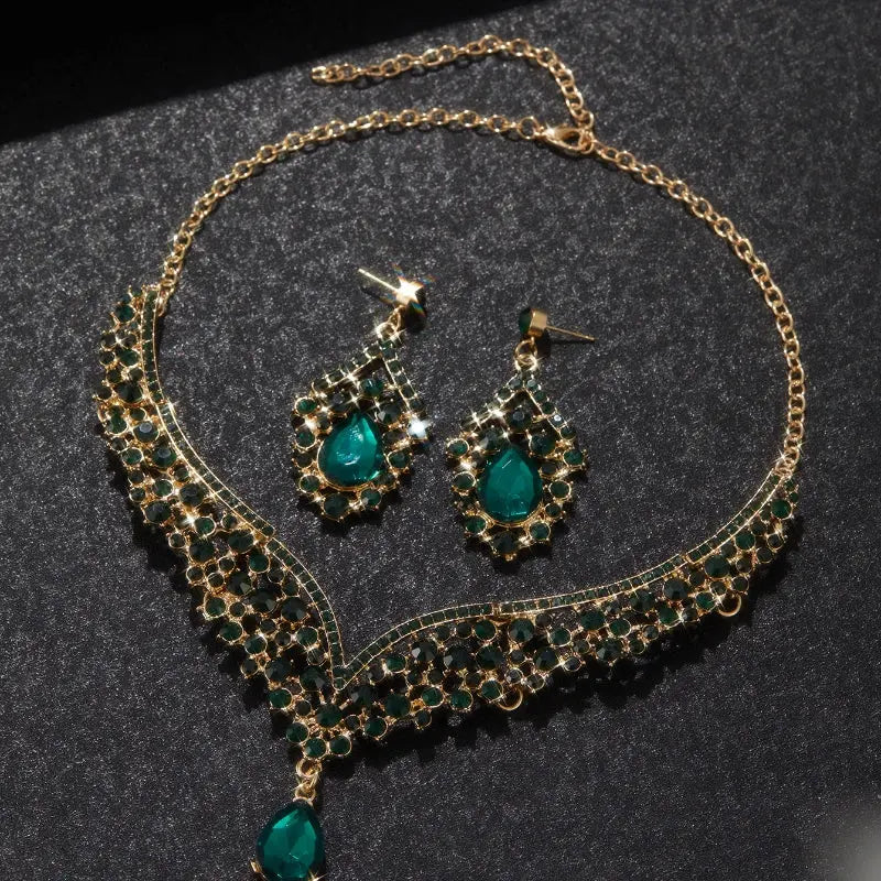 Jewelry set with necklace and earrings on a dark surface