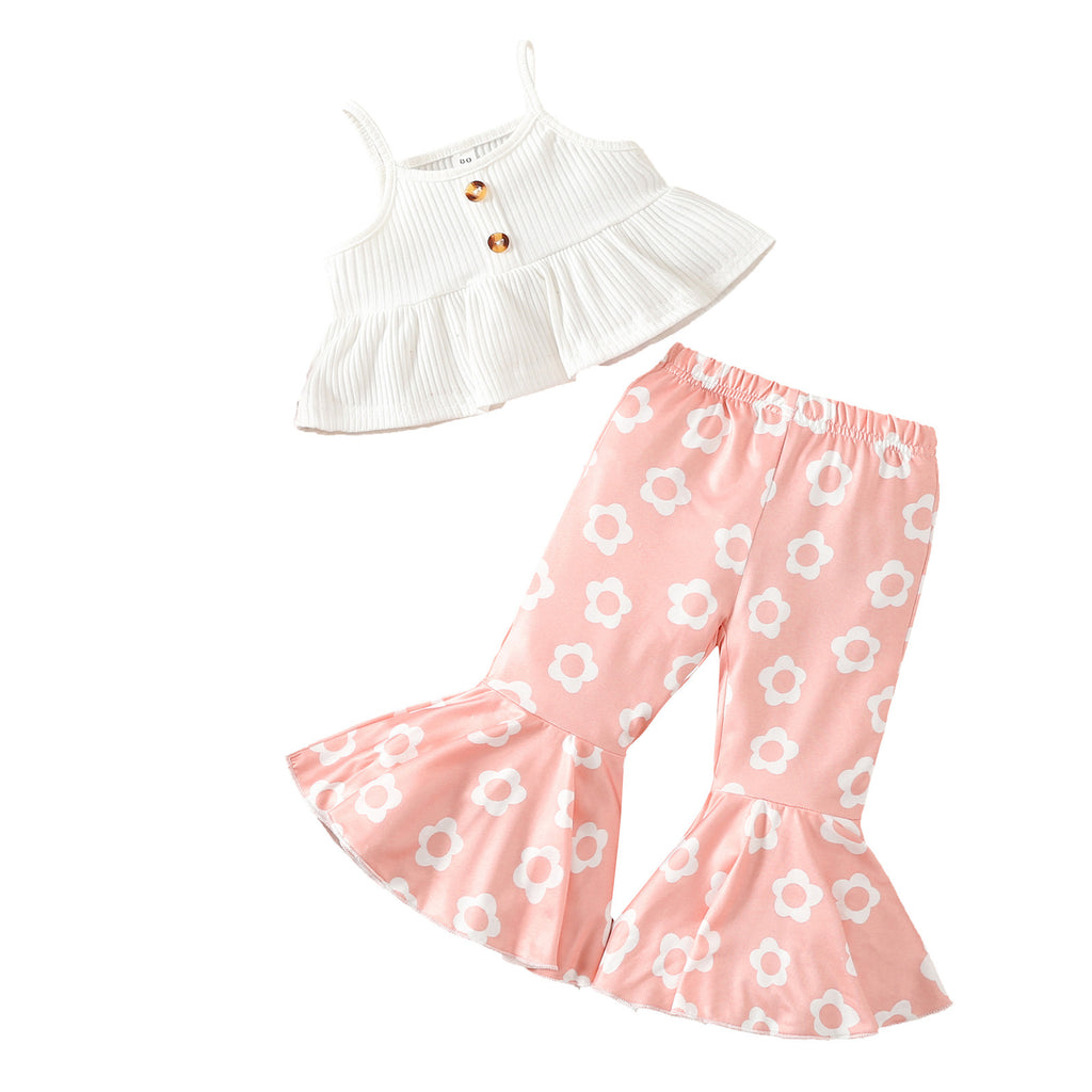Children's white spaghetti-strap top and pink floral print flared pants flat lay set
