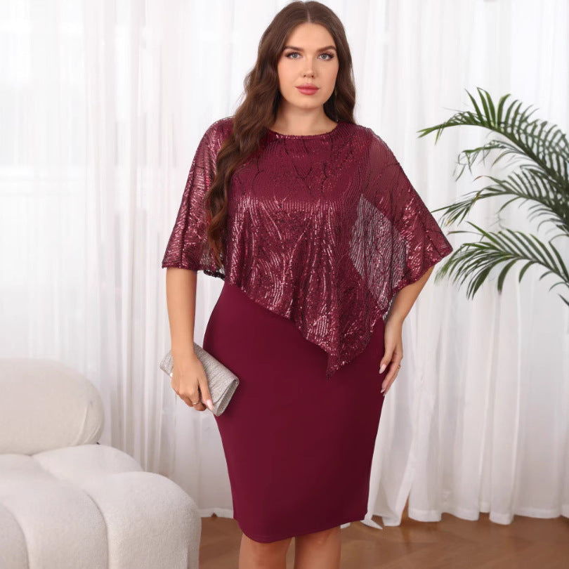 Woman wearing a burgundy dress with a sequin overlay in a room with white curtains and a plant.