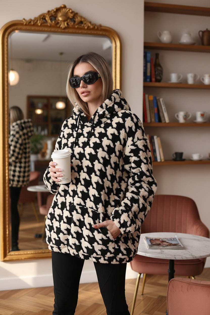 Houndstooth plush fleece hoodie women black oversized holding disposable cup profile view