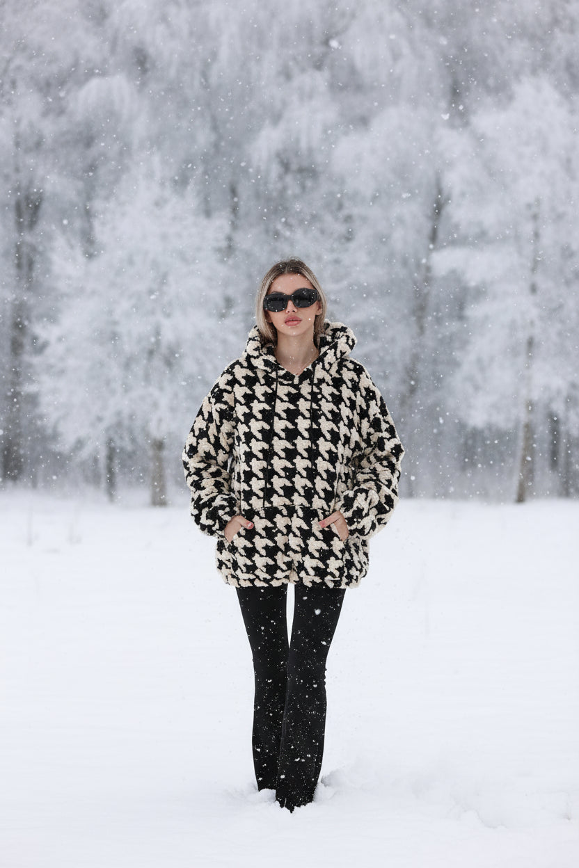 Houndstooth plush fleece hoodie women black oversized indoor lifestyle pose