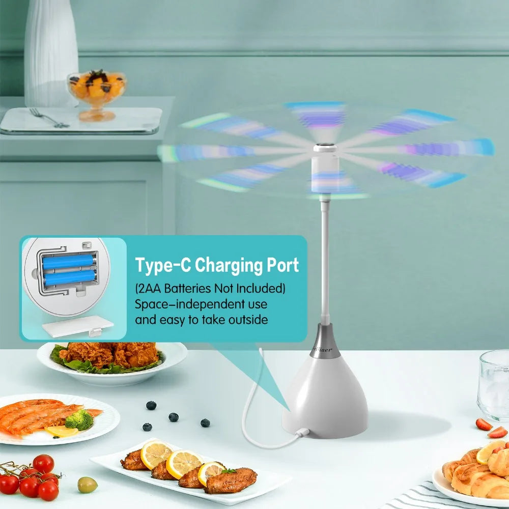 Colorful flying spinner on a table with food and a light blue wall background