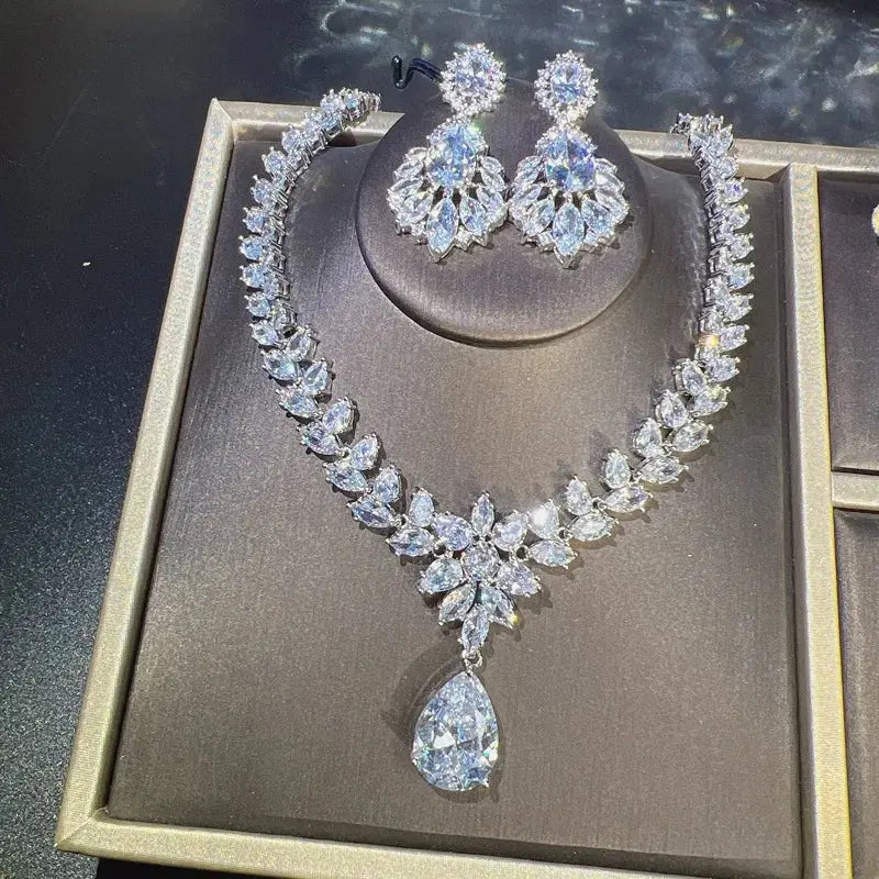 Jewelry set with necklace and earrings on a gray background