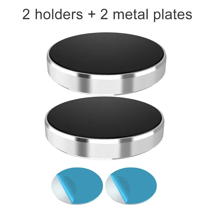Two metallic circular holders with black centers on a white background, accompanied by two blue circular objects.