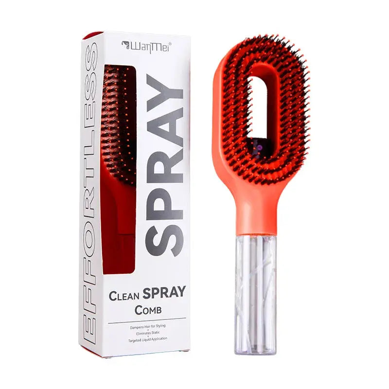 Hairbrush with red bristle head and clear handle next to its packaging on a white background