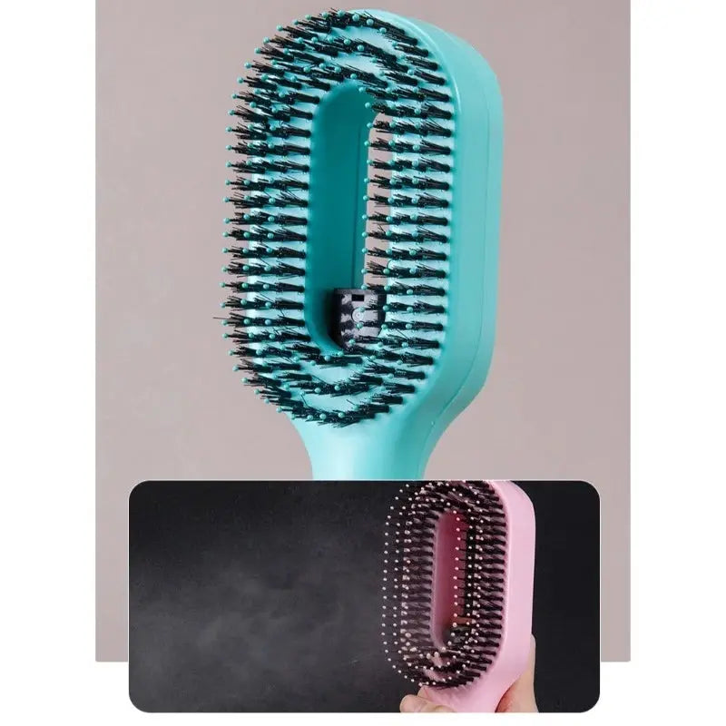 Teal hairbrush with black bristles on a beige background