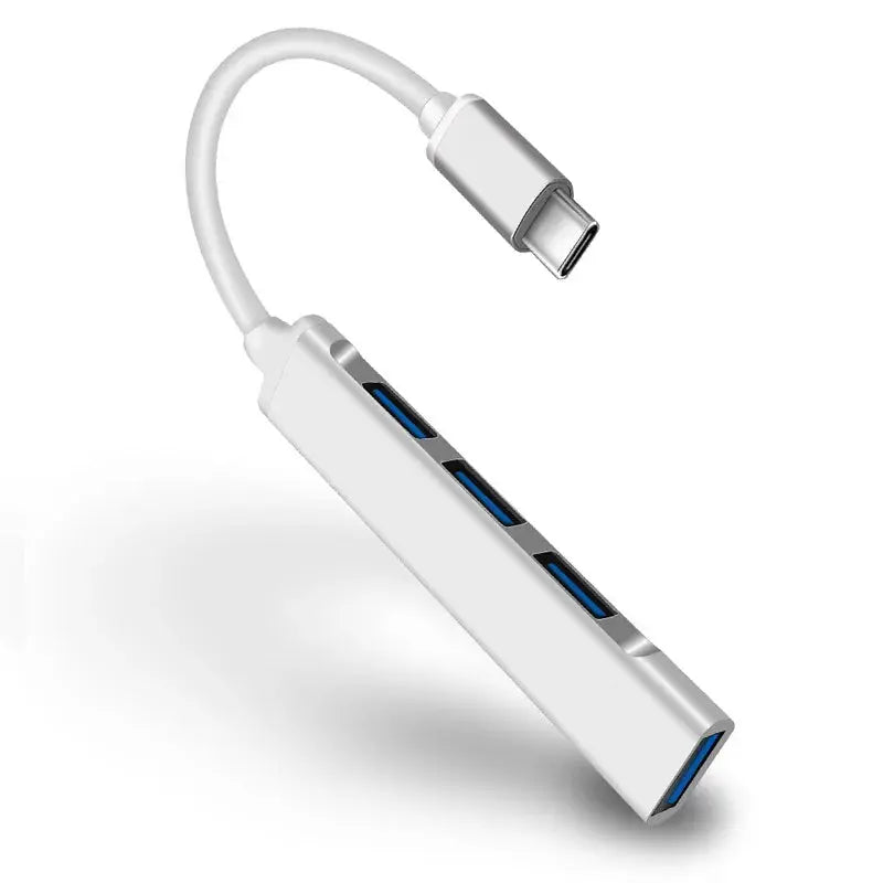 White USB-C hub with multiple ports on a white background