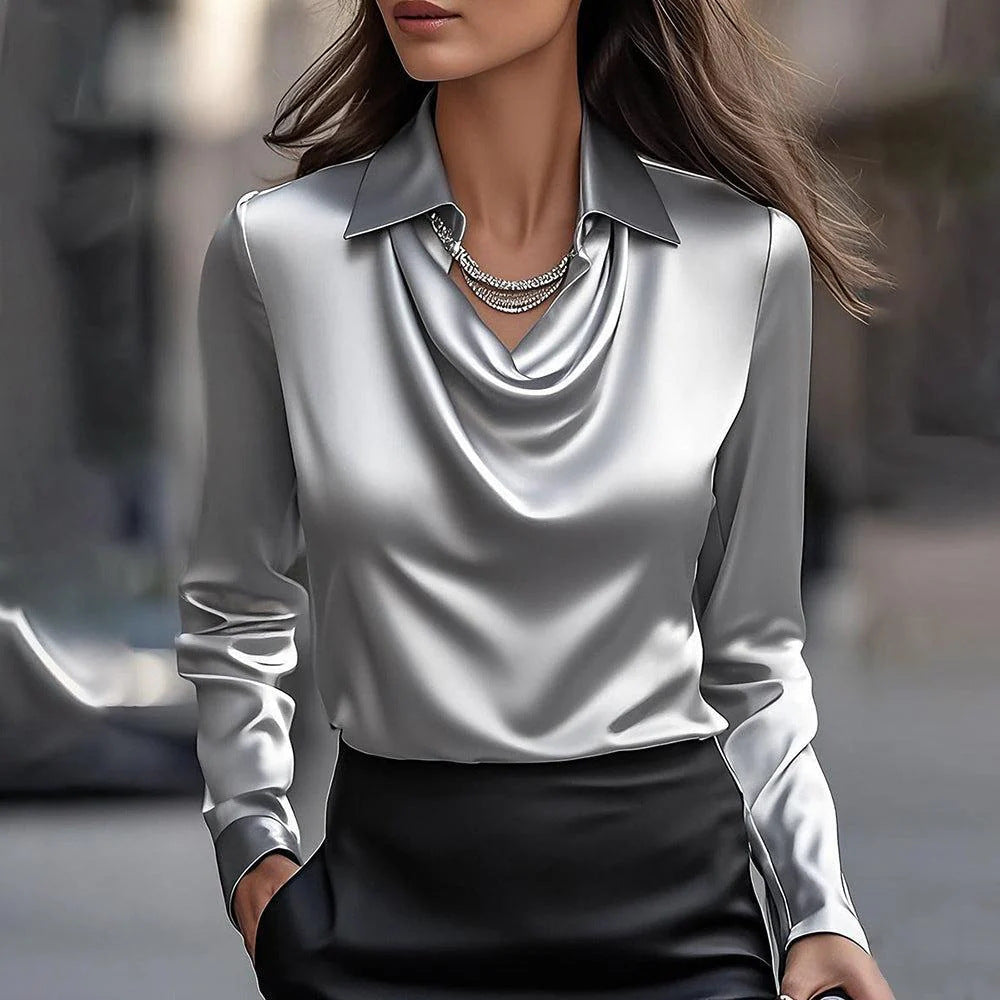 Front view of a woman wearing a sophisticated grey satin office top