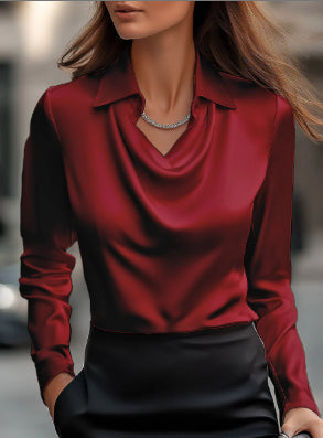 Front view of a woman wearing a bold red satin pullover blouse